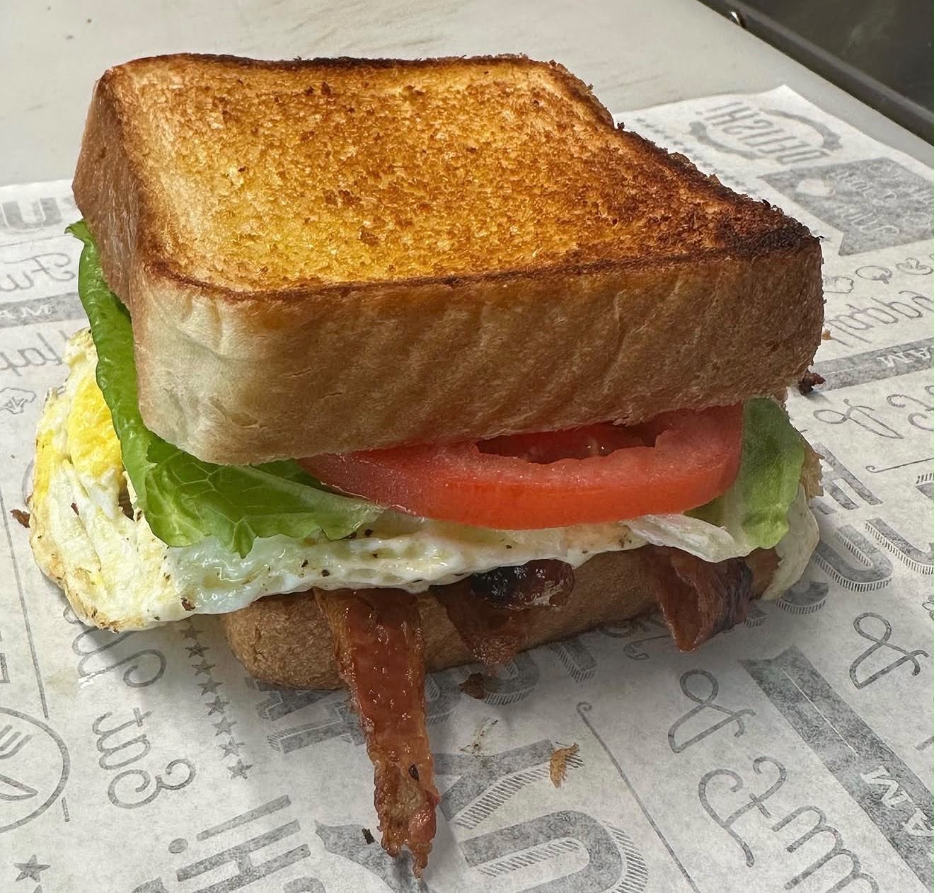 Eve's Garden Deli Micah's BLT with bacon egg lettuce and tomato on toasted Texas toast